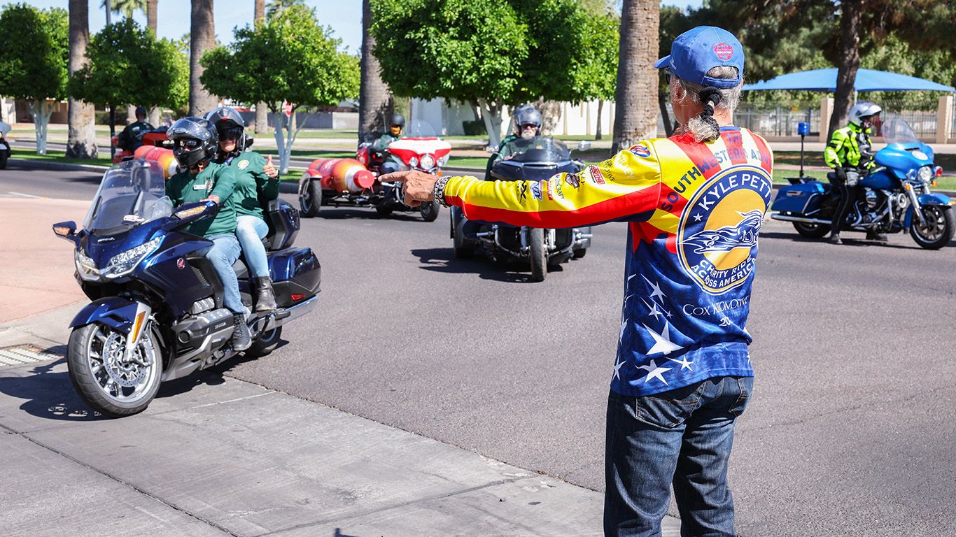 Kyle Petty directing traffic at charity event