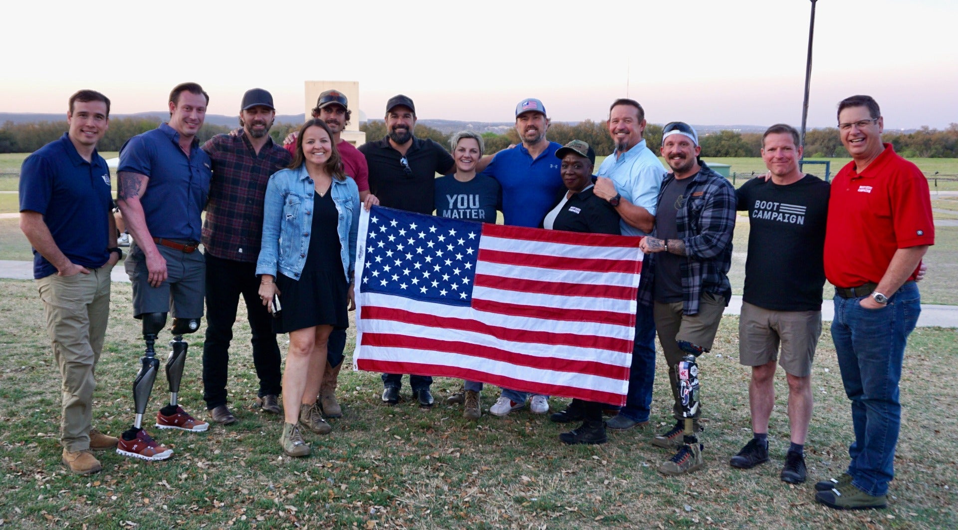 Veterans at Boot Campaign Event holding the American Flag