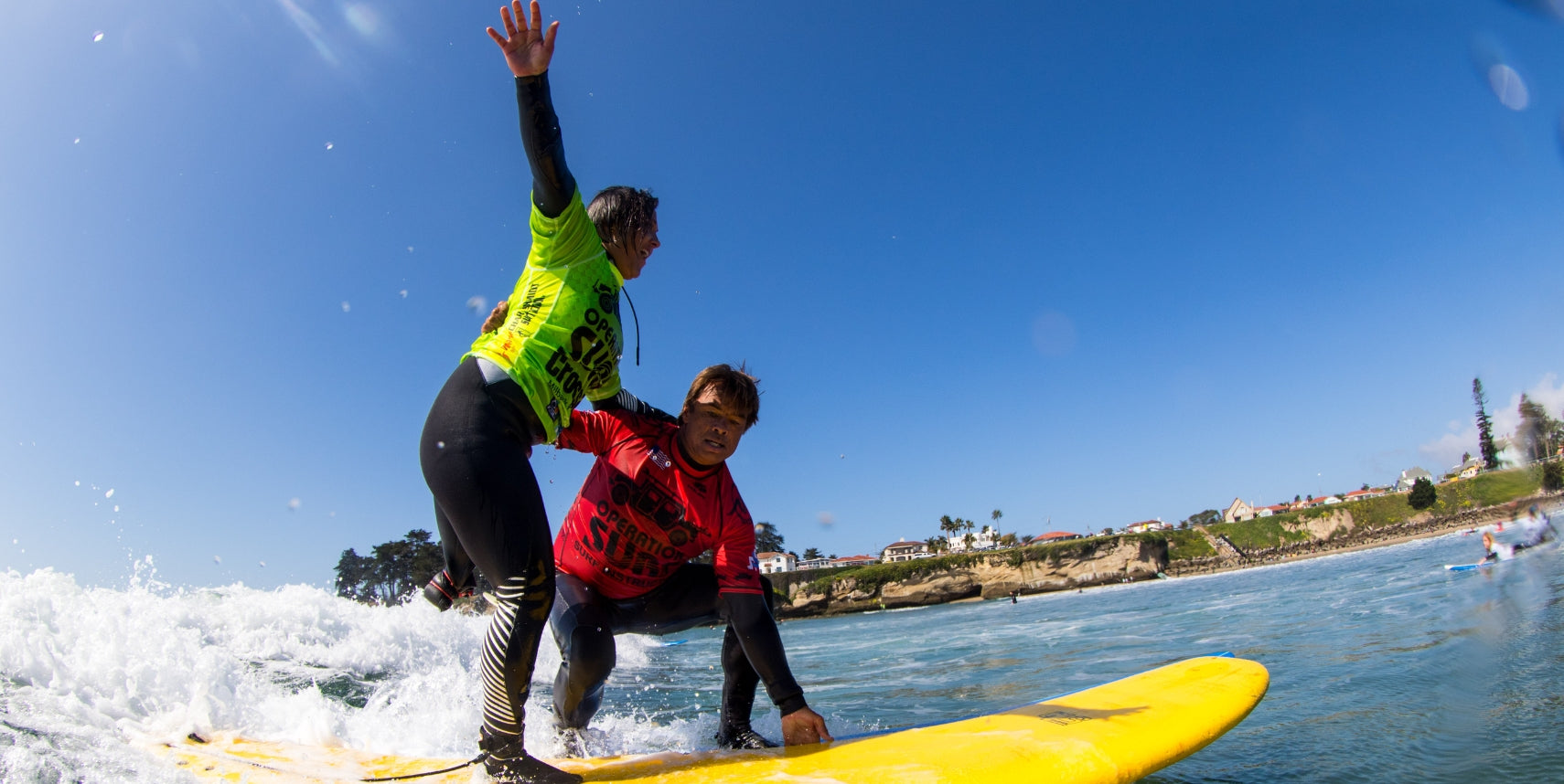 Operation Surf attendees surfing together